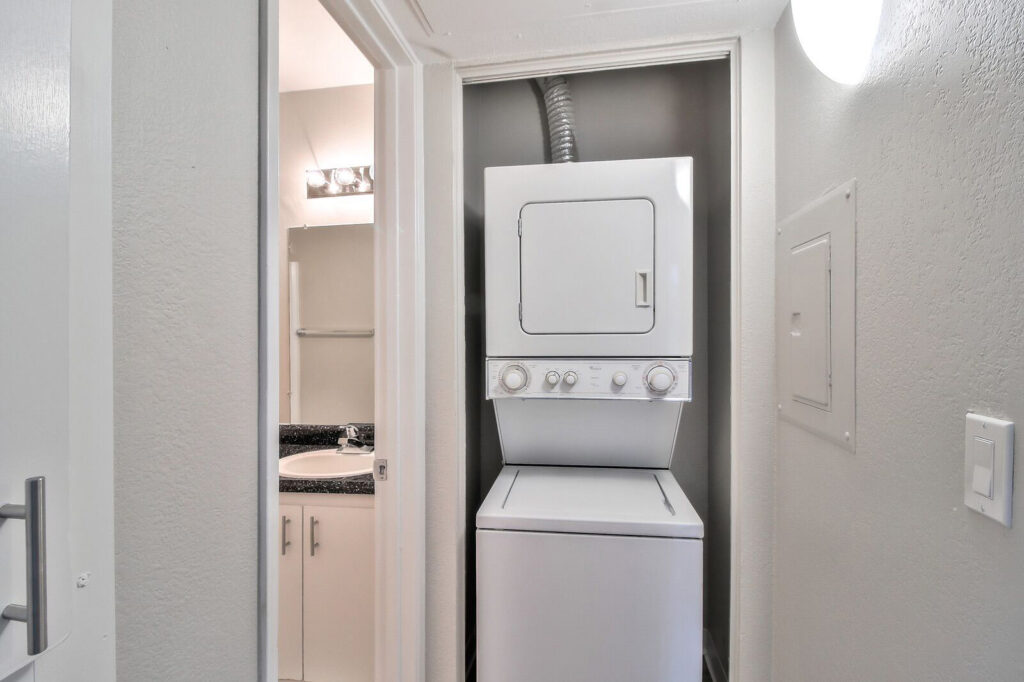Stacked washer and dryer in a closet