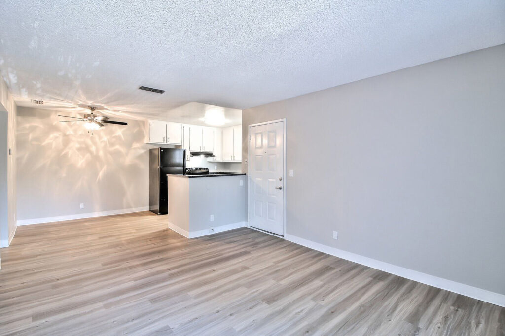 Living room with view into the kitchen